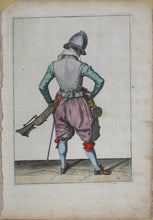 Load image into Gallery viewer, Jacques de Gheyn II. Marksman seen from behind, on guard shaping the match between his thumb and his forefinger. Colored engraving. 1607.